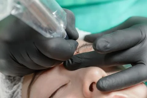 Permanent makeup. Permanent tattooing of eyebrows Stock Photos