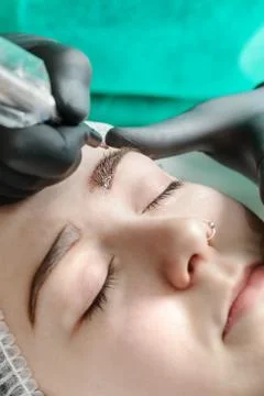 Permanent makeup. Permanent tattooing of eyebrows Stock Photos