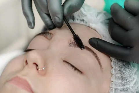 Permanent makeup. Permanent tattooing of eyebrows Stock Photos