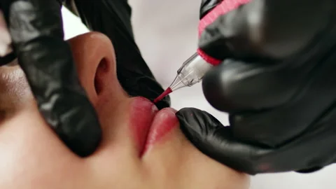Permanent makeup procedure applying rose red pigment Stock Footage 239014809