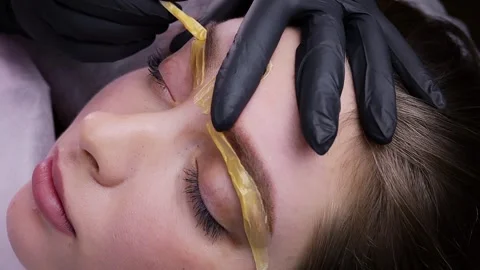 Permanent makeup procedure, performing PMU of eyebrows Stock Footage 262448164