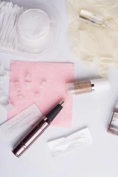 Permanent makeup set with tattooing machine around white background Stock Photos
