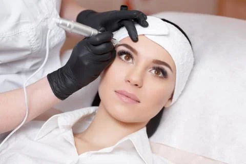 Permanent makeup. Tattooing of eyebrows Stock Photos