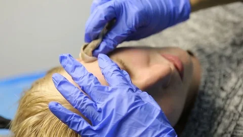 Permanent tattooing of eyebrows Stock Footage