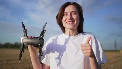 Permission to fly a drone. The operator of the quadcopter shows the like and the Stock Footage 137703121