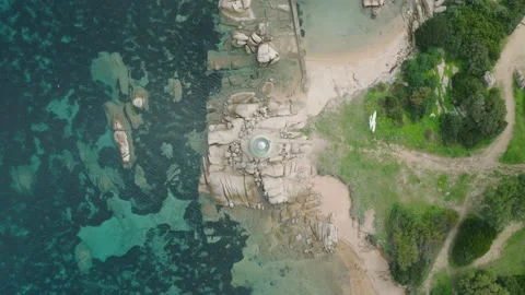 Perpendicular aerial shot of a lighthouse on a cliff Stock Footage 233928110