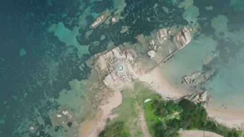 Perpendicular aerial shot of a lighthouse on a cliff Video stock 233928396