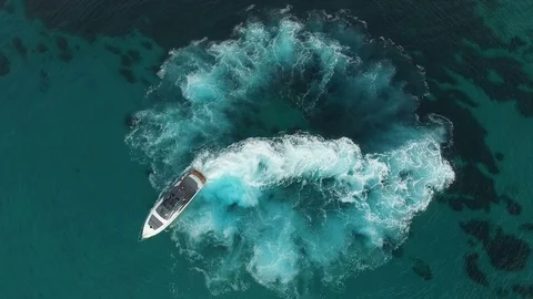 Perpendicular aerial view of a yacht navigating Stock Footage 72299120