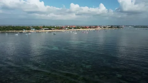 Perpendicular waves on the beach with lot of boats Stock Footage 152252577