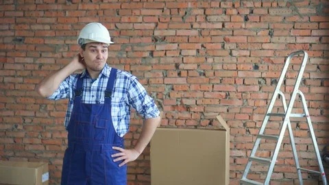 Perplexed and confused man in working uniform waving his arms Stock Footage 99575848