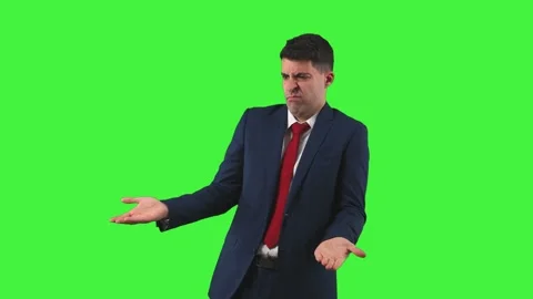 Perplexed Businessman Looking Sideways and Holding Suit Green Screen Chroma K Stock Footage 272835104