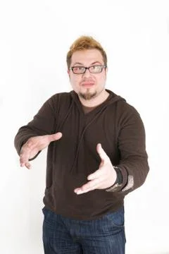 Perplexed Man with Glasses and Brown Sweatshirt Stock Photos