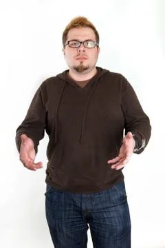 Perplexed Man with Glasses and Brown Sweatshirt Stock Photos