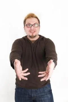Perplexed Man with Glasses and Brown Sweatshirt Stock Photos