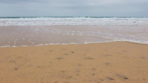 Perran Sands 03 Tide coming in waves lapping against the beach Slow Motion Stock Footage 116509452