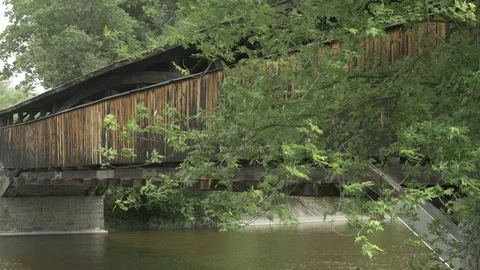 Perrine's Covered Bridge With Trees Blowing in Wind Stock Footage 77450346