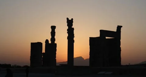 Persepolis columns in silhouette as sun sets behind the Zagros Stock Footage 320272035