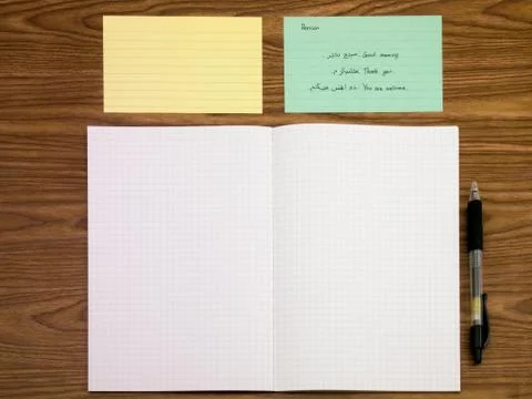 Persian; Learning New Language Writing Words on the Notebook Stock Photos