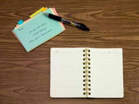 Persian; Learning New Language Writing Words on the Notebook Stock Photos