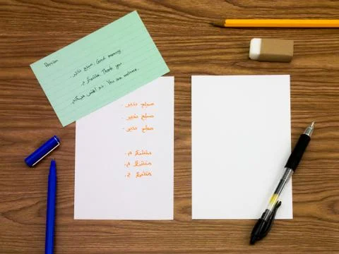 Persian; Learning New Language Writing Words on the Notebook Stock Photos