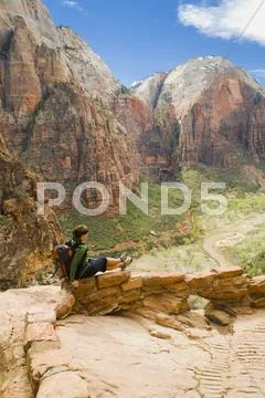 Persian Woman Sitting On Canyon Path