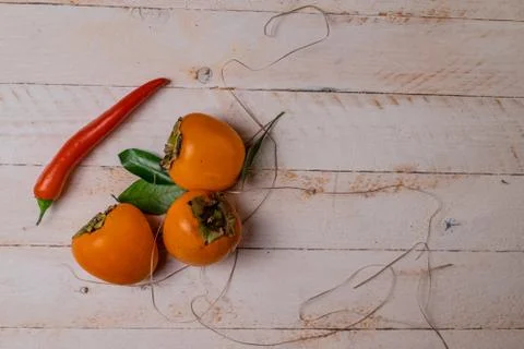 Persimmon and red pepper Foto stock