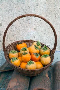 Persimmon basket Stock Photos