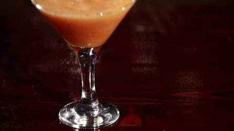 A persimmon cocktail is on the bar. Stock Footage 80309333