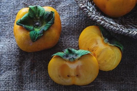 Persimmon fresh close up on background Stock Photos