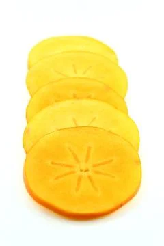 Persimmon fruit slices Stock Photos