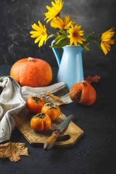 Persimmon, pumpkin, corn Stock Photos