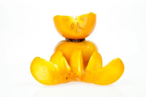 Persimmonson and slice Stock Photos