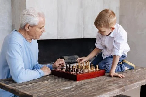 Persistent little kid learning how to play Stock Photos