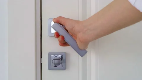 Persistently pull the door handle. Open a closed door. the white interior door i Video stock 205919412
