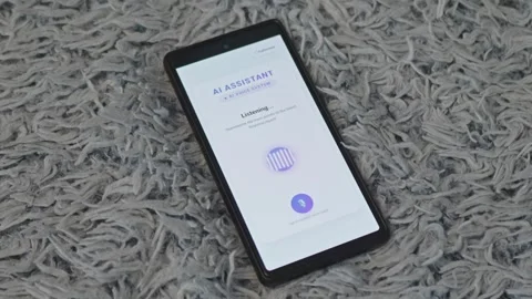 Person activating AI voice system application on mobile phone to analyze Stock Footage 341569489