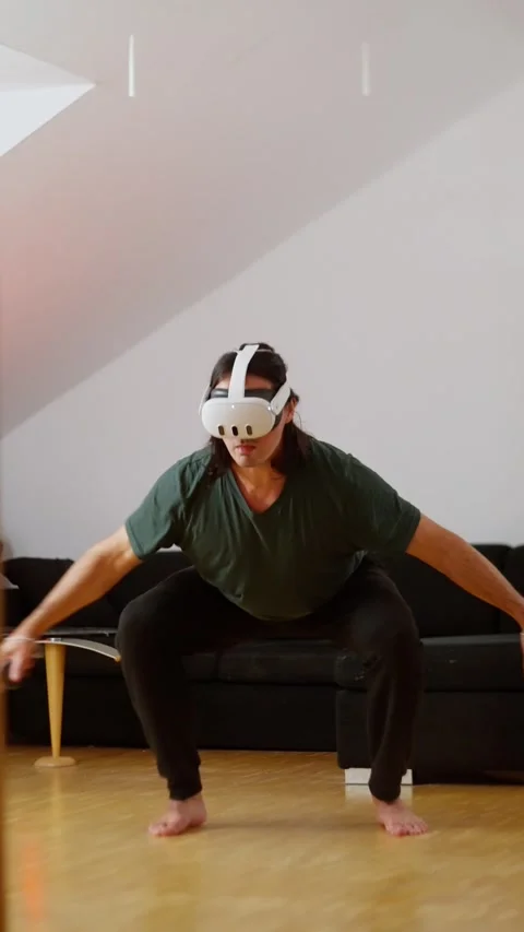 A person actively engaged in a virtual reality activity, showcasing the amazing Stock Footage 313631376