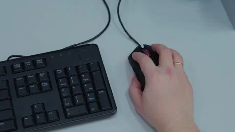 A person is actively using a computer mouse while video gaming Stock Footage 274176548