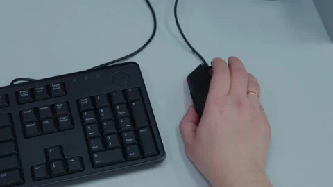 A person is actively using a computer mouse while playing video games Video stock 276662657