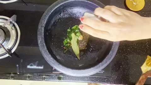 Person adding few ingredient inside vessels Stock Footage 312381406