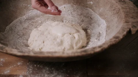 Person adding ingredients to dough Video stock 130380876