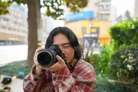 Person aiming camera through viewfinder Stock Photos