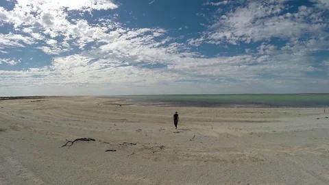 Person amid Millions of tiny white shells on Australia shell beach Video stock 70967997