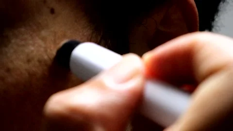 A person applying concealer to their face Stock Footage 335278920