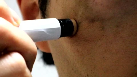 A person applying concealer to their face Stock-Footage 335359828