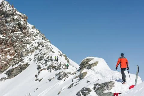 Person ascendind a mountain Stock Photos