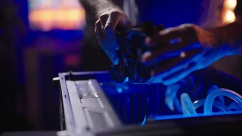 Person assembling gaming computer with graphic card GPU 4K Stock Footage 280198211