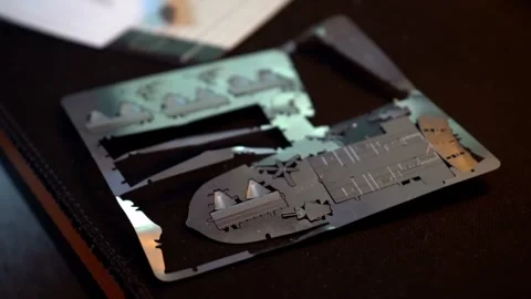 Person assembling metal airplane model with hands Stock Footage 319294038