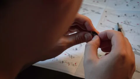 Person assembling metal airplane model with hands Stock Footage 319294049
