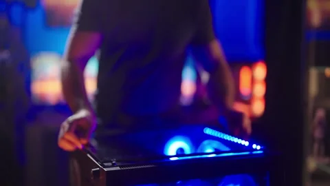 Person assembling RGB gaming computer glass panel 4K Stock Footage 280198057