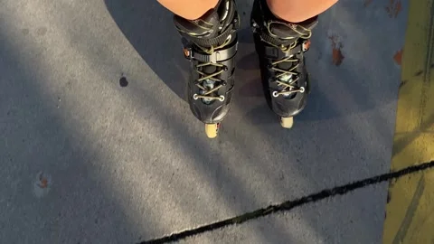 Person balancing on inline skates, top-down view Stock Footage 345361735